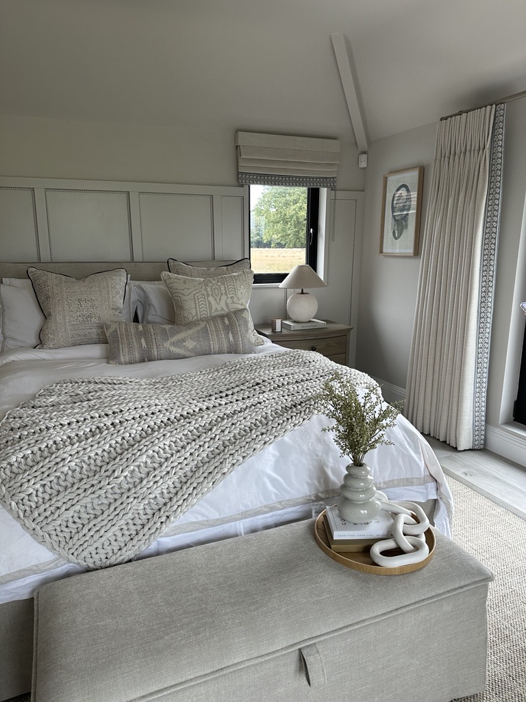 Calm neutral bedroom interior with textured bedding